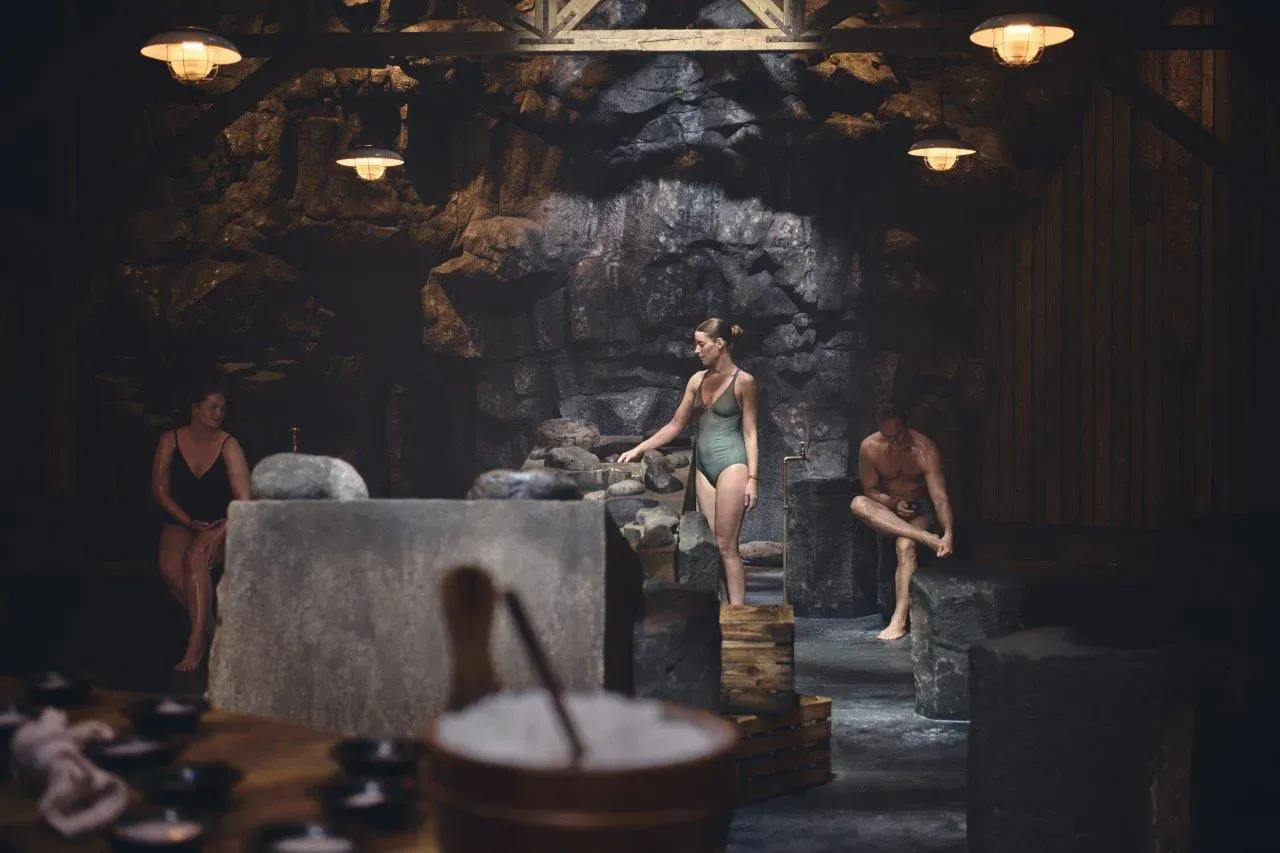Guests in the stone steam room of the Sky Lagoon ritual