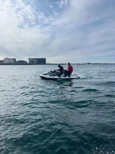 Two riders on a jet ski on Reykjavík Bay